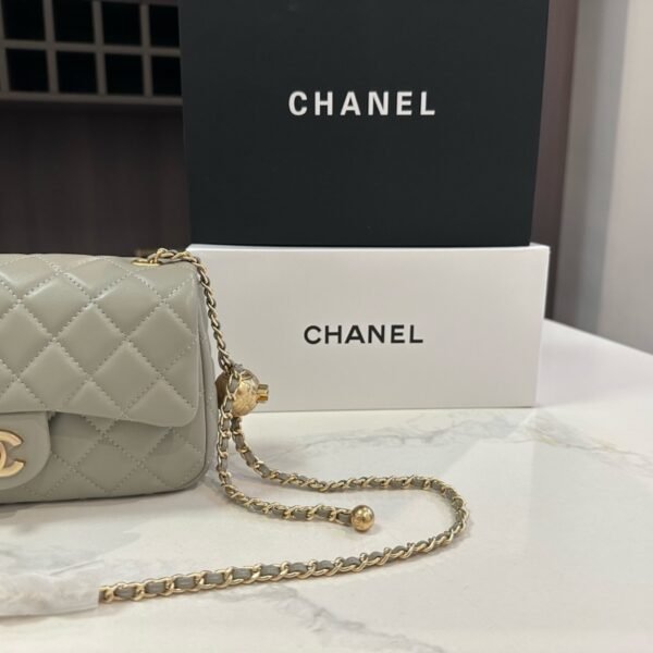 e9c6b9b2427e2a1155486e69facaa25e178a9396 103-Chanel Classic Flap Bag with Gold Ball